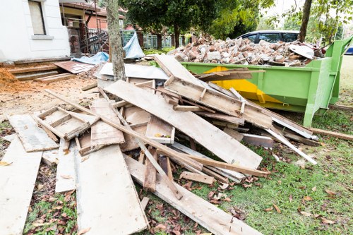 Waste removal truck collecting garbage in Ilford