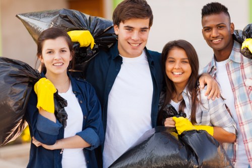 Workers using PPE while managing commercial refuse
