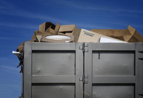 Workers sorting recyclable materials from commercial rubbish in Ilford