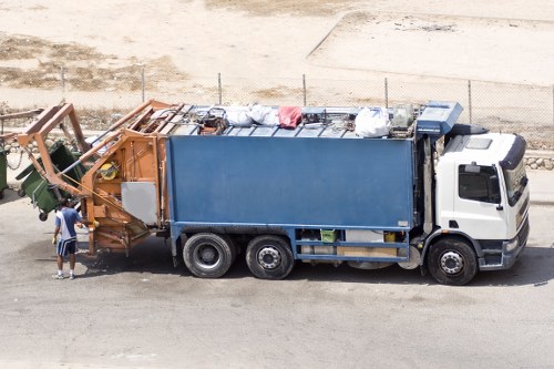 Driver performing vehicle safety checks for waste collection truck